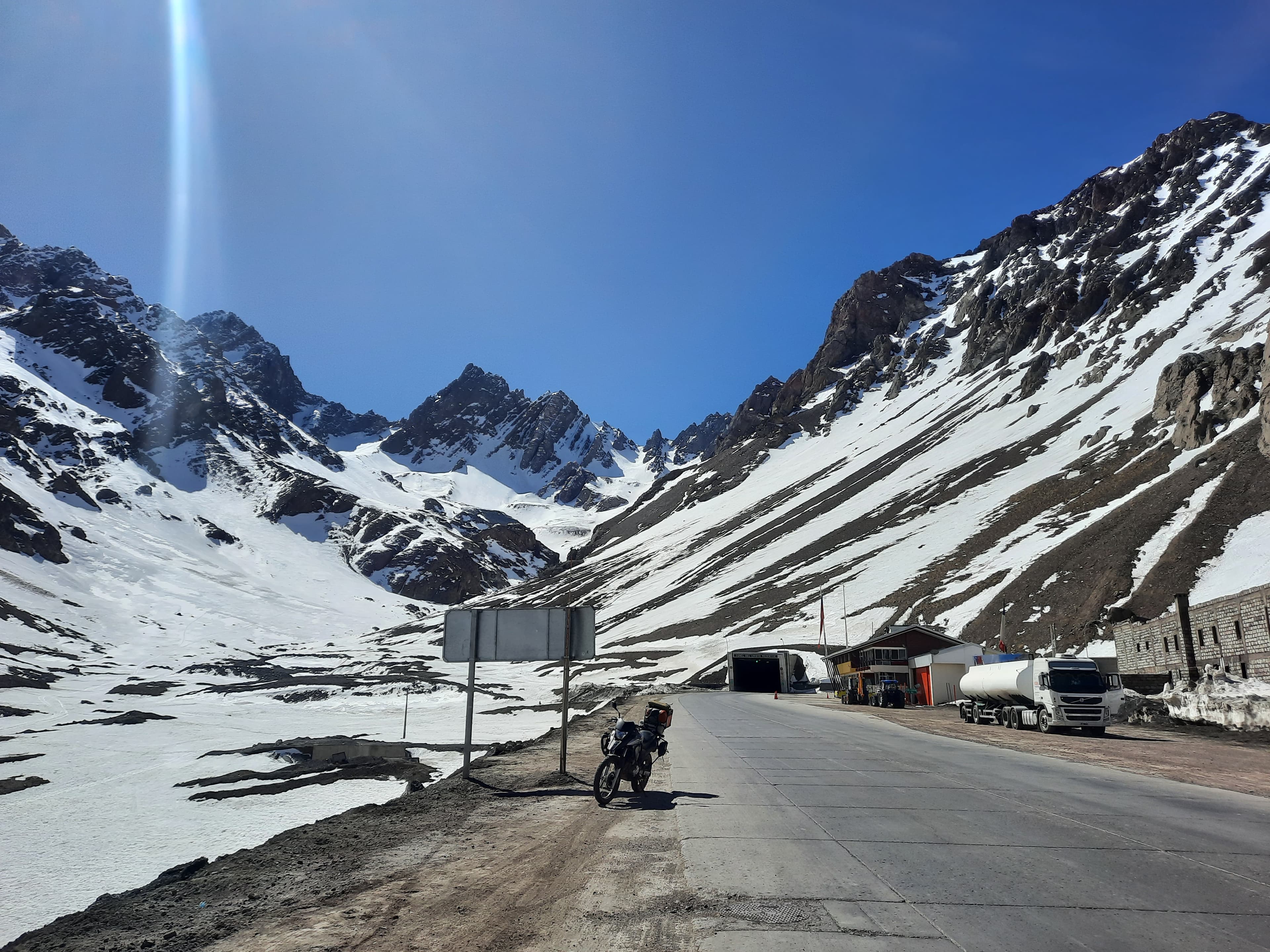 Loaded adventure motorcycle on a mountain road