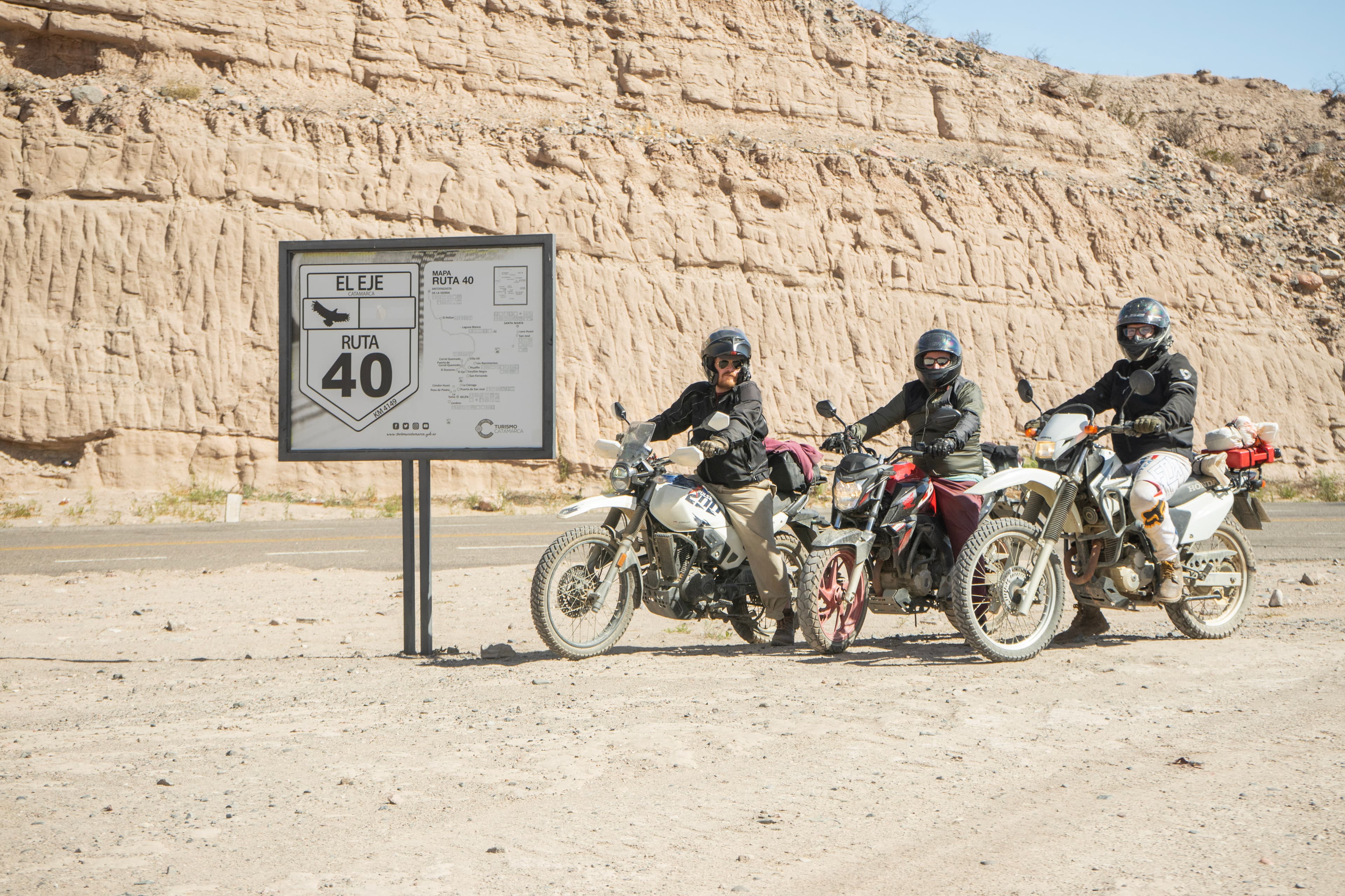 Group of adventure motorcycles on a gravel road