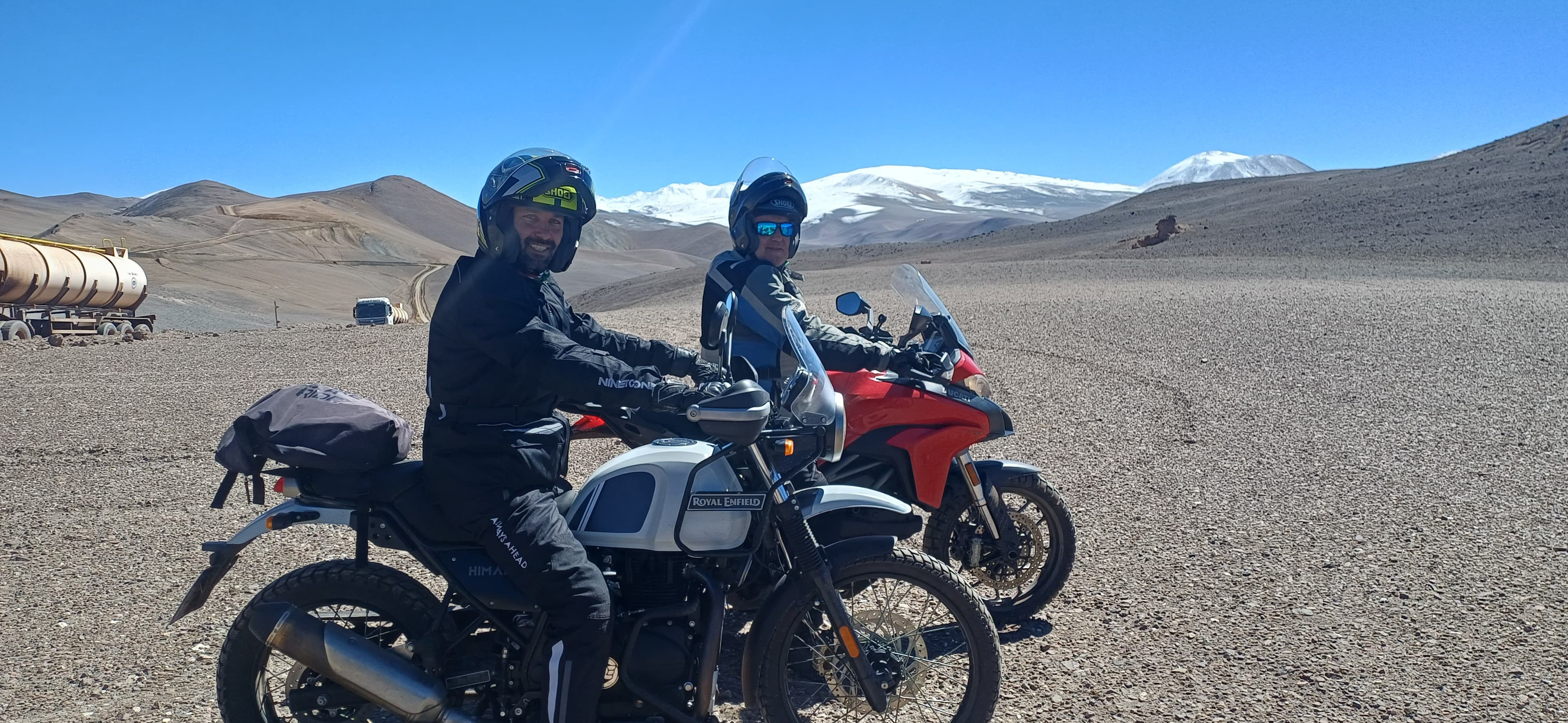 Adventure motorcycle stopped on a gravel road