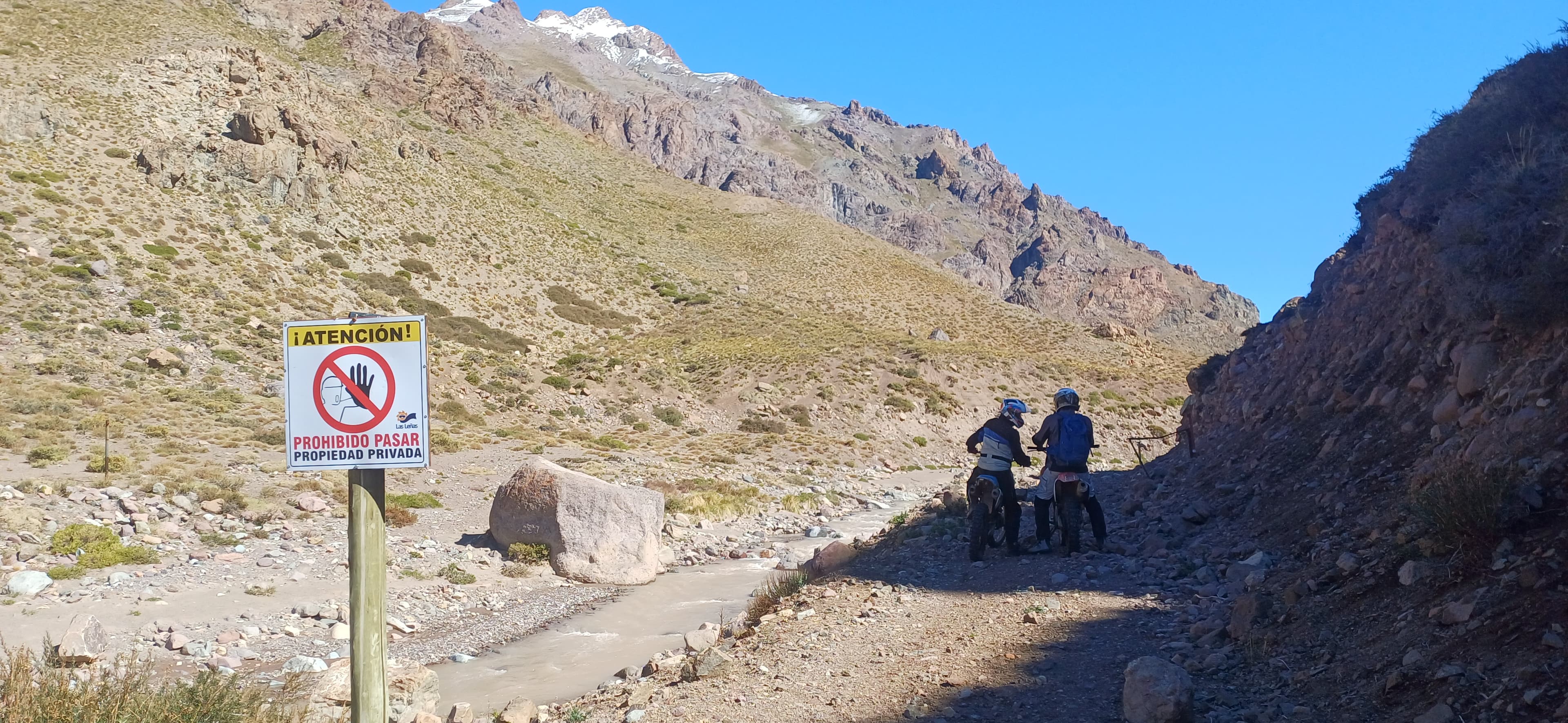 Mountain road cutting across an arid Cuyo valley during a route test.