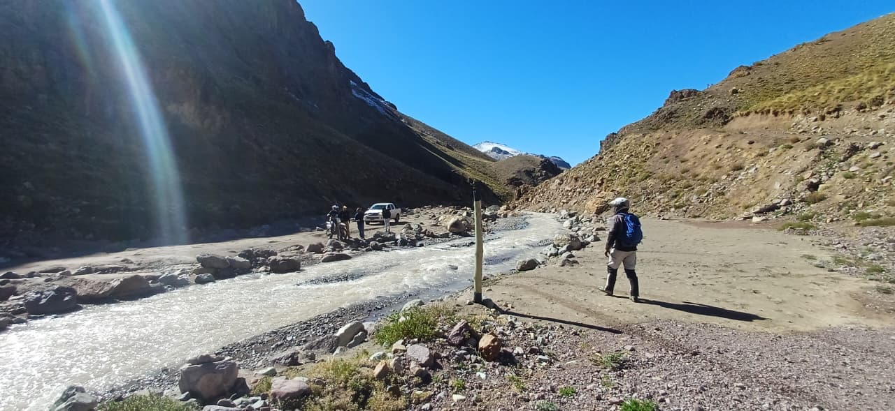 Team stopped beside a water crossing in a Catamarca gorge.